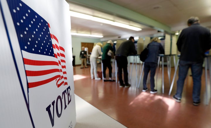 Voters cast their ballots, Tuesday, Nov. 6, 2018, in Gates Mills, Ohio.