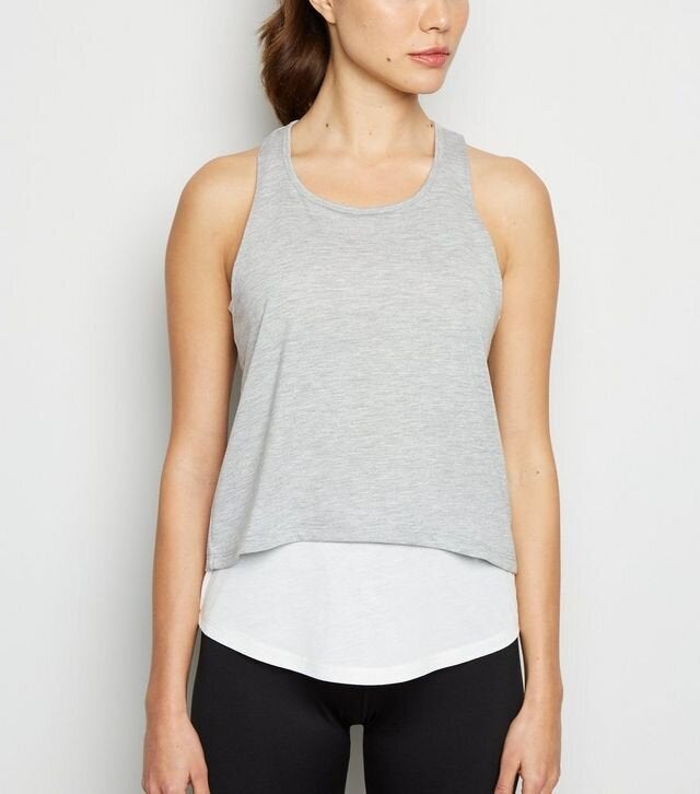 <a href="https://fave.co/35rx1M9" target="_blank" rel="noopener noreferrer">Grey 2 In 1 Sports Vest, New Look,</a> £12.99 