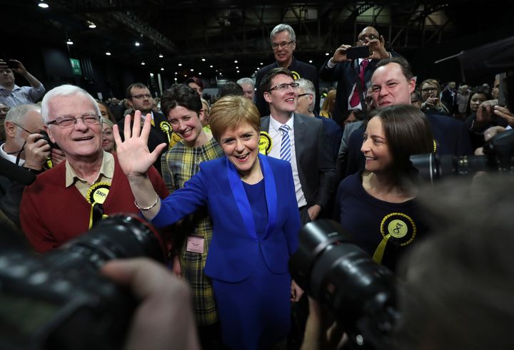 Nicola Sturgeon waves as she arrives at the SEC Centre in Glasgow for the election count on Friday.