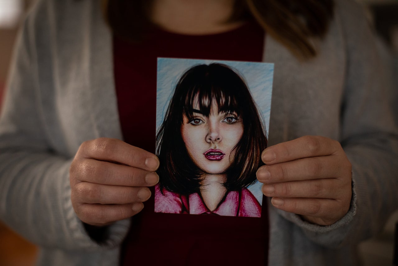 Kim Devins holds a drawing of her daughter Bianca. 