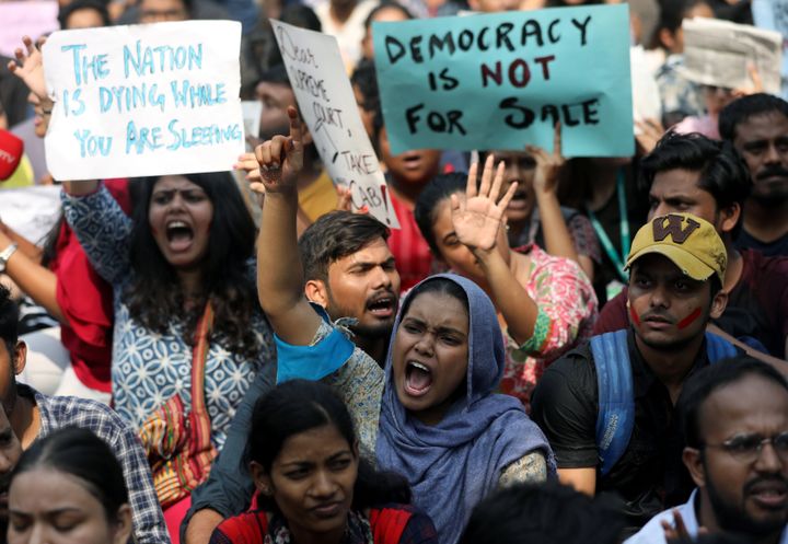 Students hold placards and shout slogans in solidarity with Jamia Millia Islamia university students, in Mumbai on December 16, 2019.