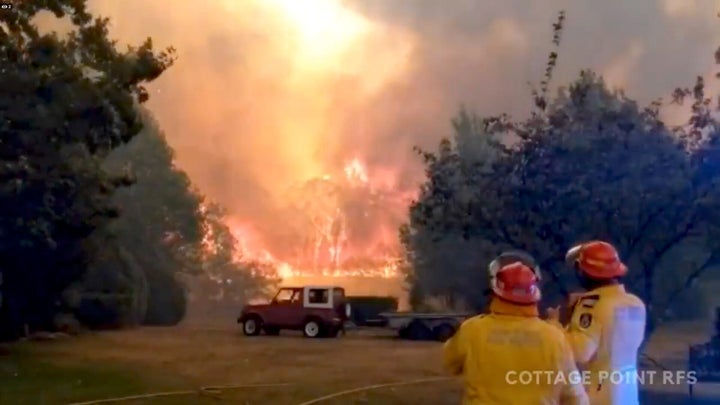 Firefighters work at the scene of a bushfires in Bilpin, New South Wales, Australia in this still image from a social media video December 15, 2019.