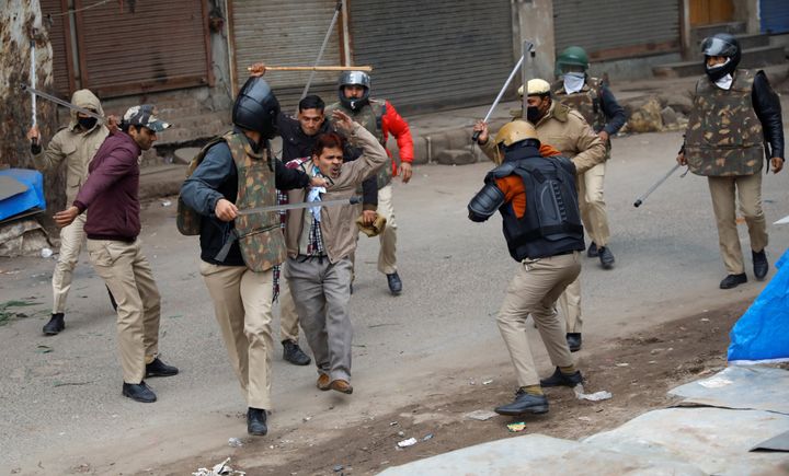 The police lathi charged the protesters and fired tear gas to disperse the crowd. 