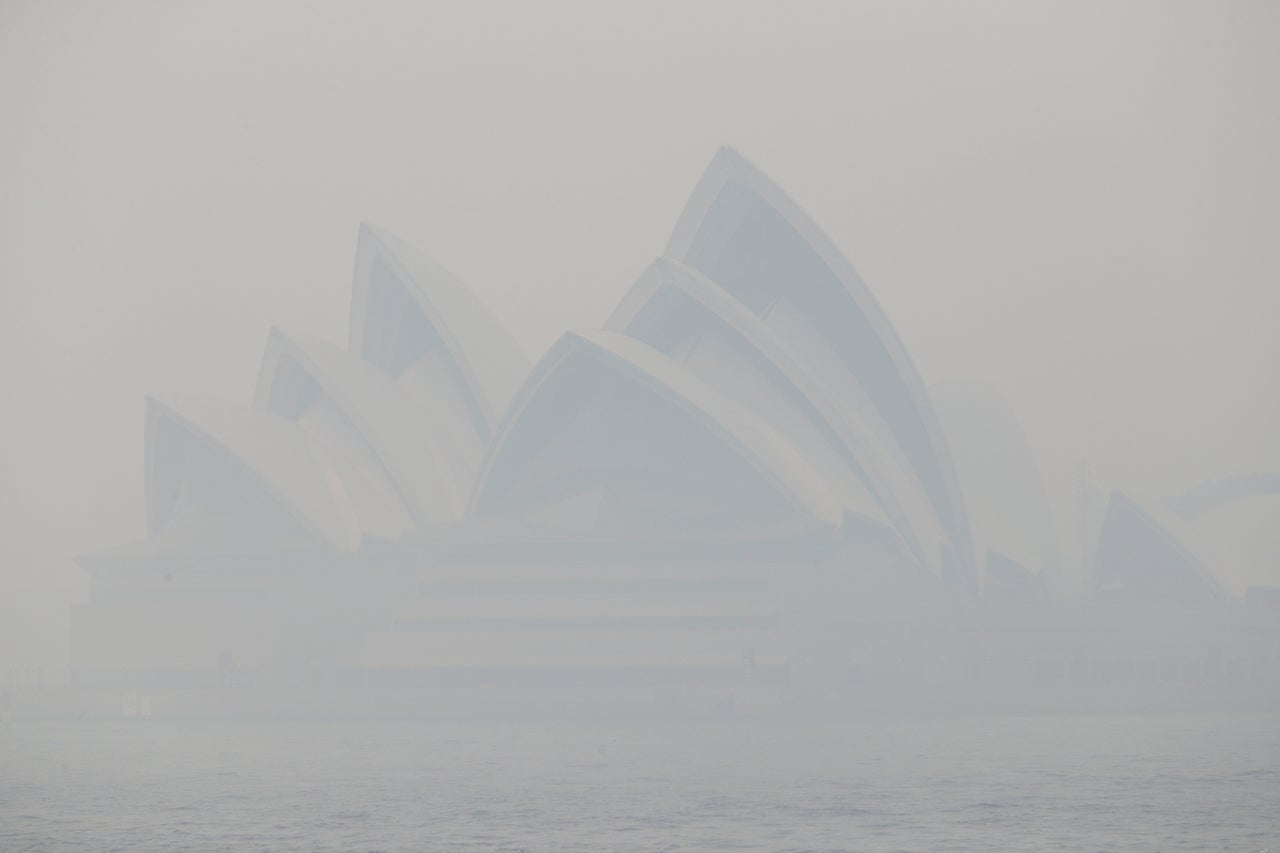 Thick smoke from wildfires shrouds the Opera House in Sydney on 10 December. Hot, dry conditions brought an early start to the fire season.