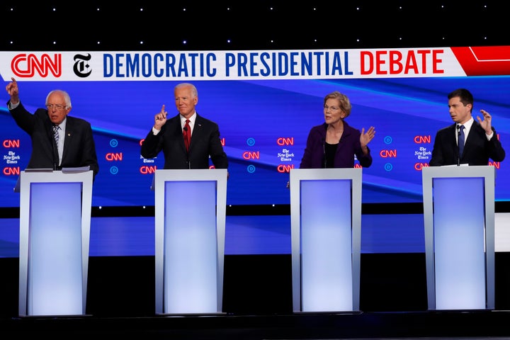 From left, Sen. Bernie Sanders (I-Vt.), former Vice President Joe Biden, Sen. Elizabeth Warren (D-Mass.) and South Bend, Indiana, Mayor Pete Buttigieg all gesture to speak during a Democratic presidential primary debate in Westerville, Ohio, on Oct. 15.