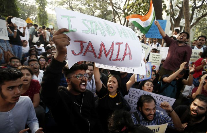 Students hold placards and shout slogans in solidarity with Jamia Millia Islamia university students, in Mumbai, December 16, 2019.