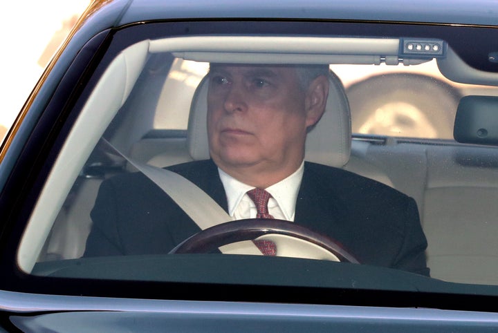 The Duke of York drives his Bentley into Buckingham Palace, London, as he arrives for the Queen's Christmas lunch. (Photo by