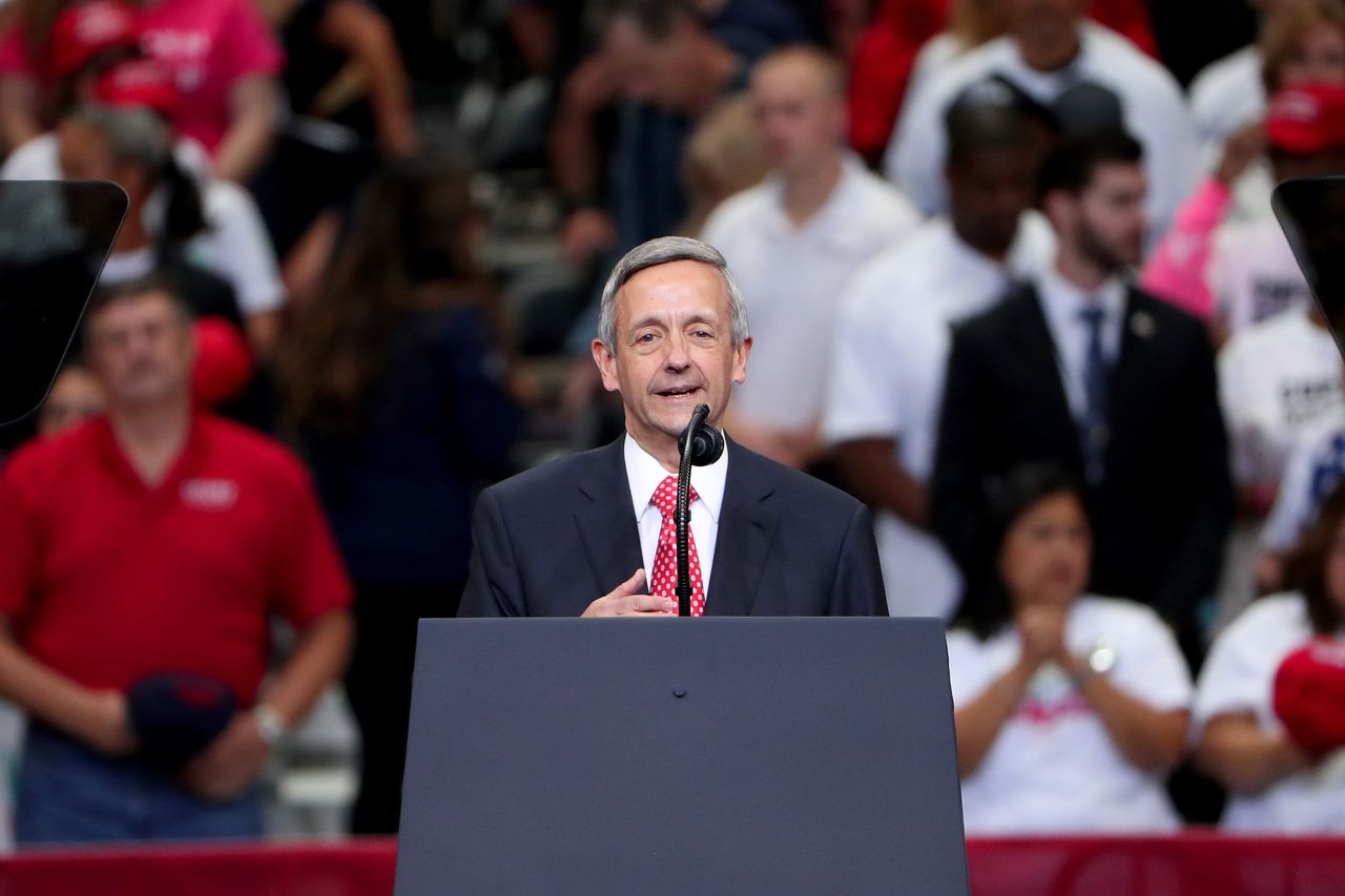Pastor Robert Jeffress leads the Pledge of Allegiance before Trump speaks during a "Keep America Great" campaign rally in Dallas on Oct. 17.