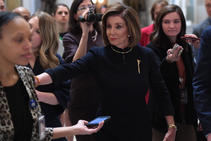 House Speaker Nancy Pelosi (D-Calif.) as she headed toward the House floor on Wednesday to open the chamber's debate on impeaching President Donald Trump.