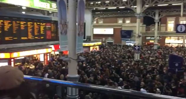 Screengrab from video taken with permission from the Twitter feed of @BROOMBY of people flooding the Victoria station main hall as disruption continues due to a signal failure at the London transport hub.