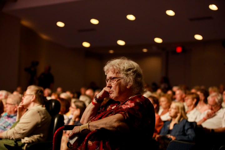 The audience listens to presidential hopefuls speak at an AARP forum in Council Bluffs, Iowa, in July. Older generations voted in disproportionately high numbers in the 2016 caucus.
