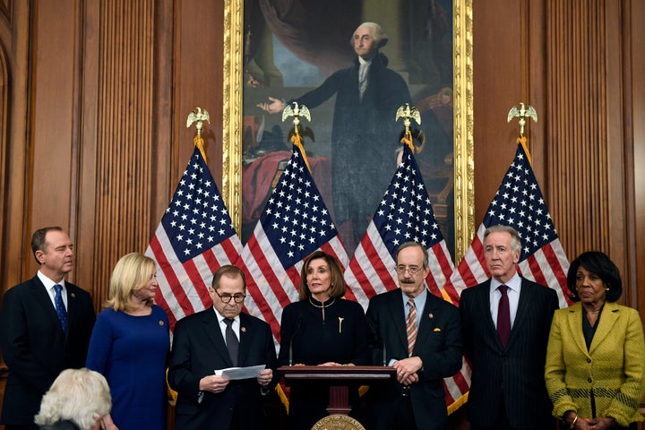 Pelosi, flanked by the chairs of several House committees, shortly after Wednesday's votes. (AP Photo/Susan Walsh)