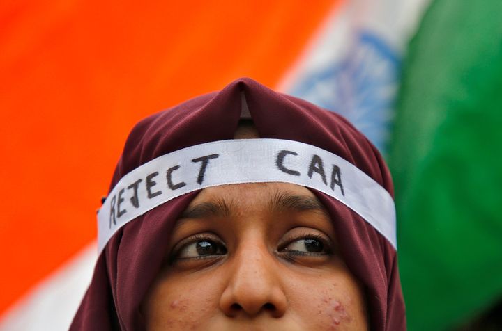 A student attends a protest march against CAA, in Kochi, December 18, 2019. 