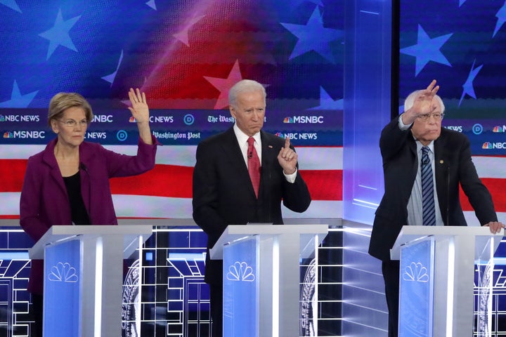 Democratic presidential candidates Elizabeth Warren, Joe Biden and Bernie Sanders participate in the November primary debate in Atlanta.