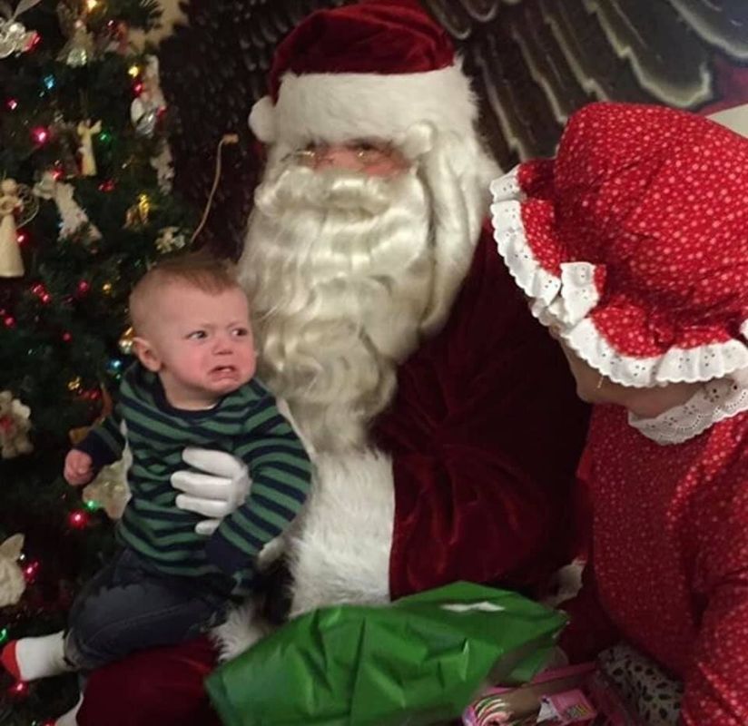 "My son ready to swing on Mrs. Claus."