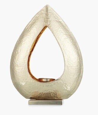 <a href="https://fave.co/2Z6RkMD" target="_blank" rel="noopener noreferrer">Hammered Teardrop Tealight Holder, John Lewis,</a> £30 
