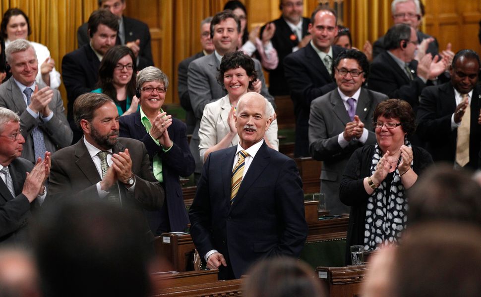 New Democratic Party leader Jack Layton receives a standing ovation while speaking in the House of Commons on Parliament Hill in Ottawa June 2, 2011.