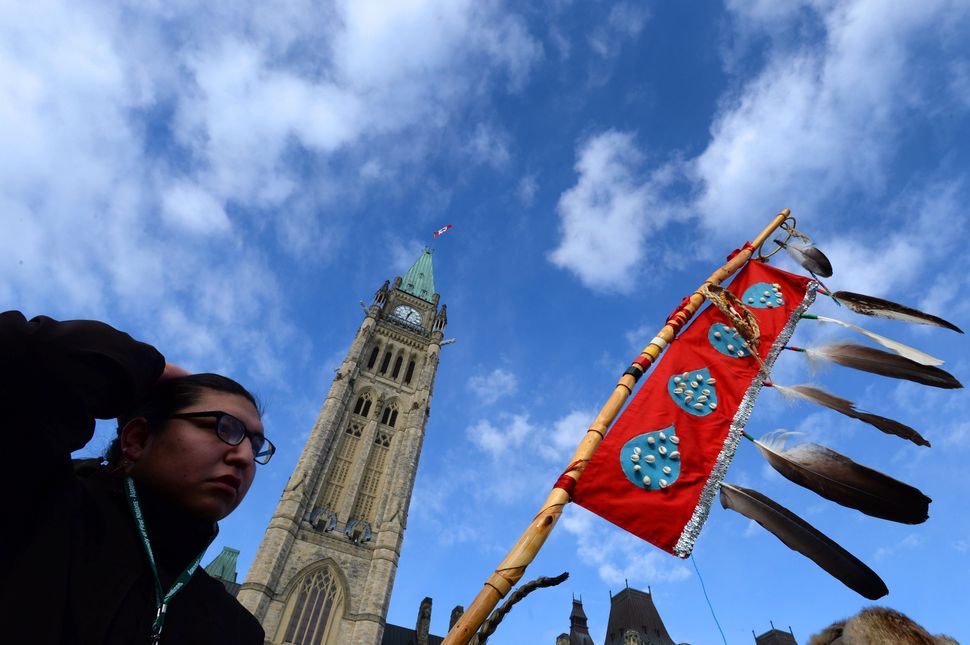 Assembly of First Nations Youth Council member Clayton Tootoosis takes part in an Assembly of First Nations rally on Parliament Hill in Ottawa on Dec. 10, 2013. 