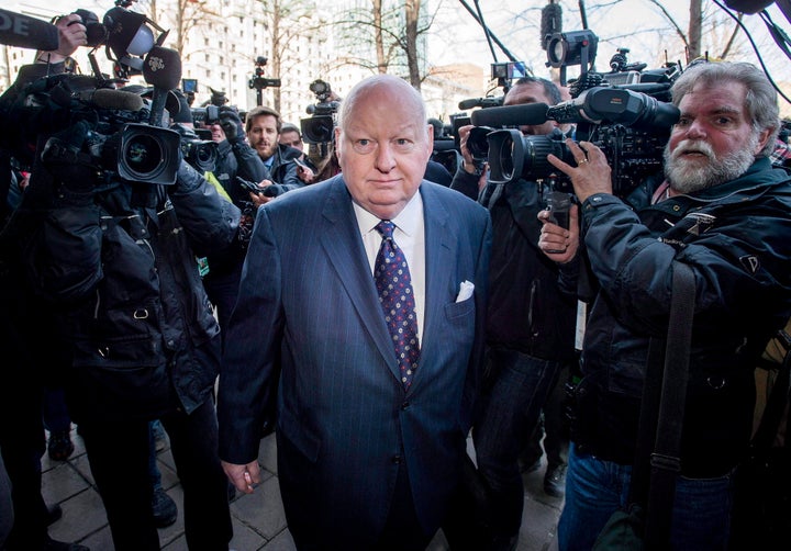 Sen. Mike Duffy arrives for his first court appearance at the courthouse in Ottawa on April 7, 2015.