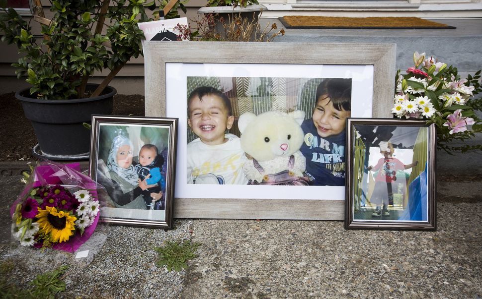 Photographs of Alan Kurdi and Galip Kurdi, who were among 12 people who drowned in Turkey trying to reach Greece, are pictured outside of Tima Kurdi's home in Coquitlam, B.C., on Sept. 3, 2015.