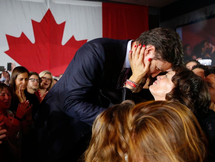 Liberal Leader Justin Trudeau is embraced by his mother Margaret Trudeau as he arrives to give his victory speech after Canada's federal election in Montreal on Oct.19, 2015.