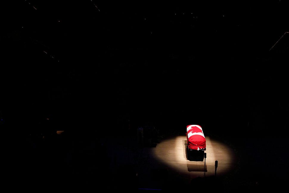 The coffin of the late NDP Leader Jack Layton sits under a spotlight during his state funeral at Roy Thomson Hall in Toronto on Aug. 27, 2011.