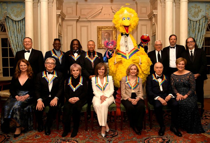 2019 Kennedy Center Honorees gather for a group photo (seated, L-R) Susan Pompeo, conductor Michael Tilson Thomas, singer Linda Ronstadt, actress Sally Field, Sesame Street co-founders Joan Ganz Cooney and Dr. Lloyd Morrisette and Kennedy Center President Deborah F. Rutter,(standing, L-R) Secretary of State Mike Pompeo, Earth, Wind & Fire band members Philip Bailey, Verdine White and Ralph Johnson and Sesame Street characters Abby, Big Bird and Elmo, and Kennedy Center producers Ricky Kirschner and Glenn Weiss, after a gala dinner at the U.S. State Department, in Washington, U.S., December 7, 2019. REUTERS/Mike Theiler TPX IMAGES OF THE DAY