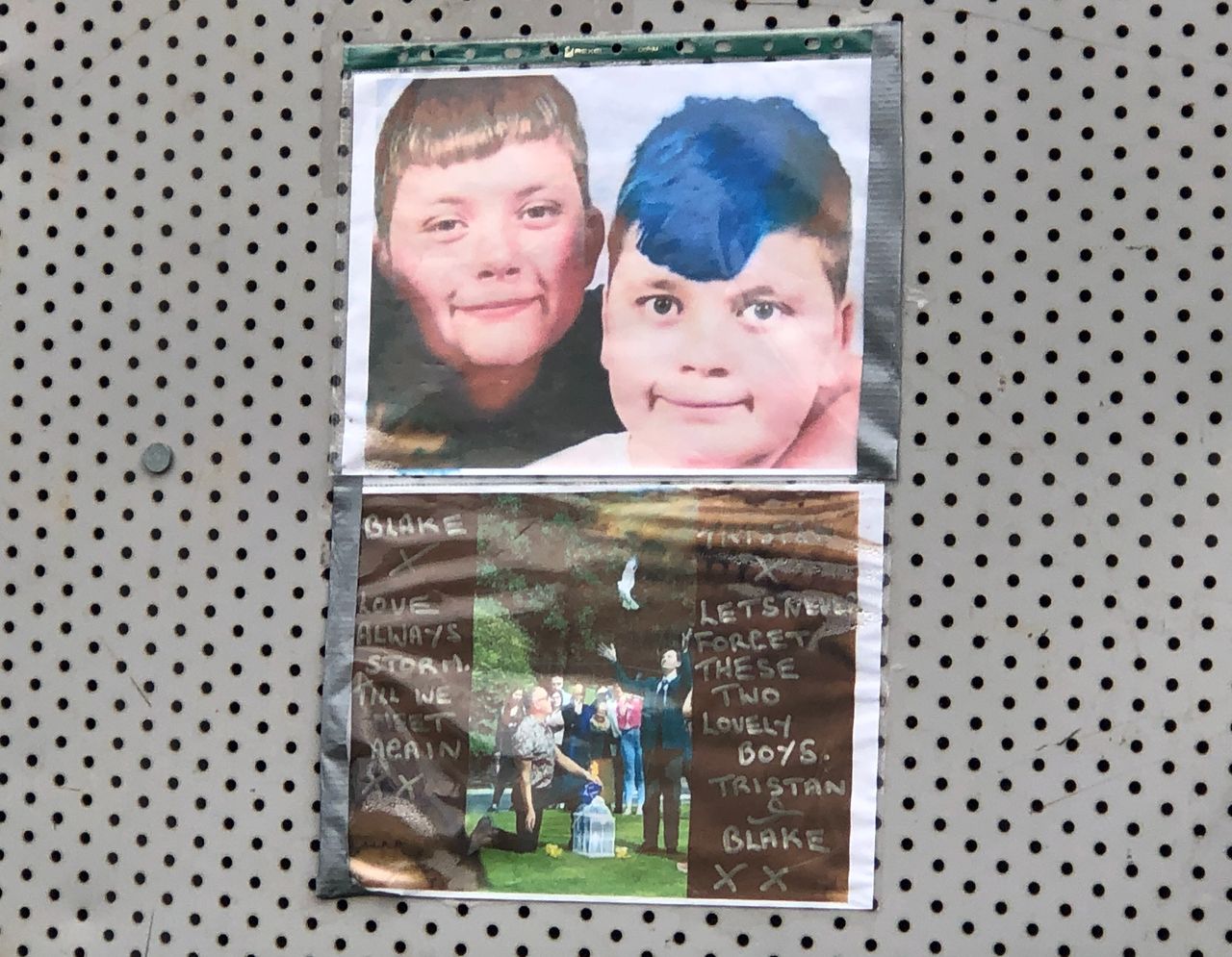 Photos on the boarded up property in Shiregreen, Sheffield, paying tribute to Blake Barrass, 14 and Tristan Barrass, 13