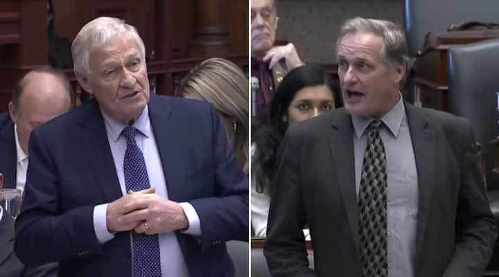 Ontario Minister Ernie Hardeman rises in the legislature to answer a question posed by his nephew, NDP MPP John Vanthof, right, on Dec. 12, 2019.