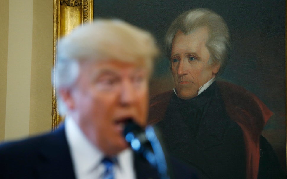 President Donald Trump speaks at the White House in front of a portrait of former President Andrew Jackson, who started a cam