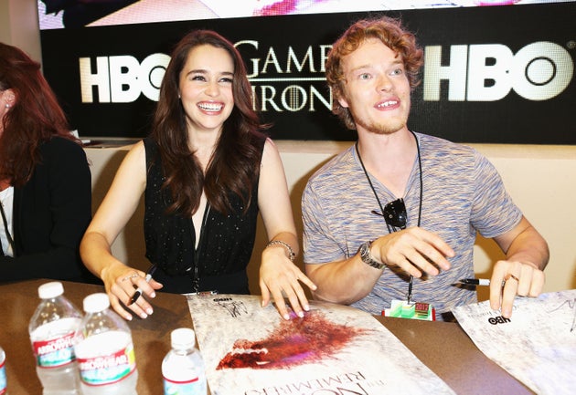 Emilia Clarke and co-star Alfie Allen at a signing for Game Of Thrones fans in 2012