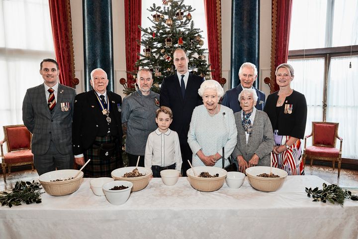 Queen Elizabeth II, the Prince of Wales, the Duke of Cambridge and Prince George, alongside (left to right) veterans Liam Young, Colin Hughes, Alex Cavaliere, Barbra Hurman and Lisa Evans, together as part of the launch of The Royal British Legion's Christmas initiative.