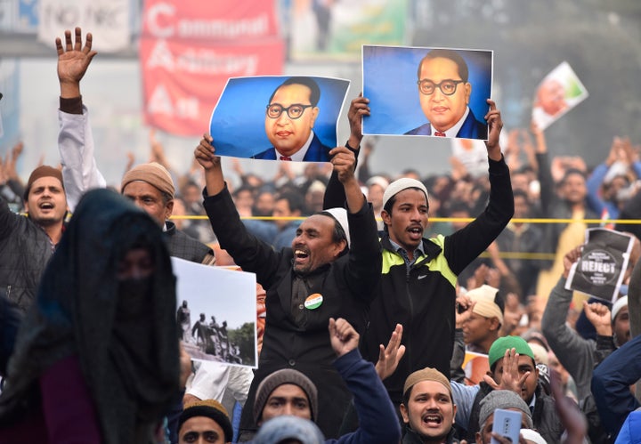 NEW DELHI, INDIA - DECEMBER 20: Protestors hold placards during a demonstration against the Citizenship Amendment Act (CAA) at Shaheenbagh, Jamia Nagar on December 20, 2019 in New Delhi, India.