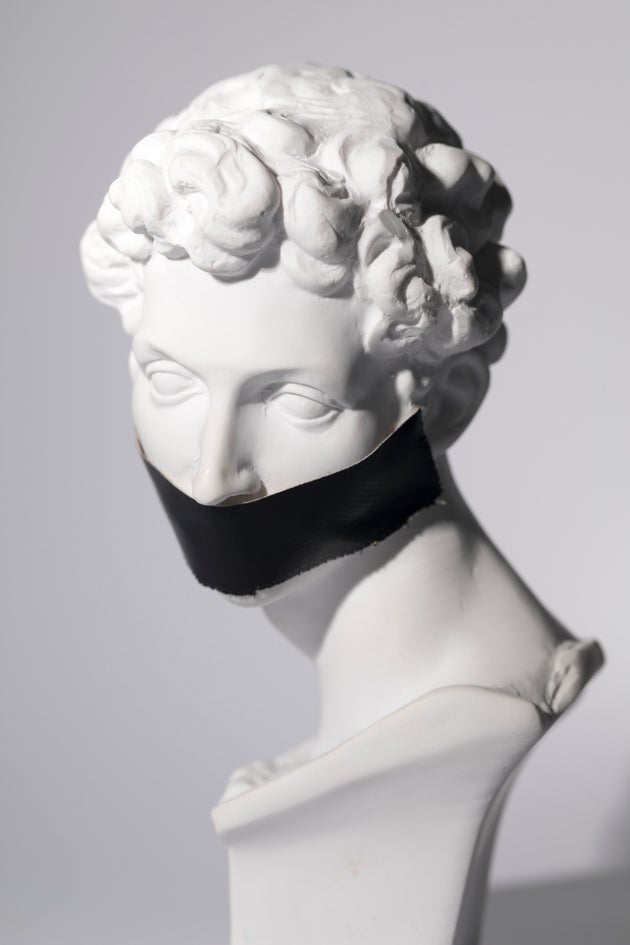 Head sculpture of Giuliano de' Medici created by Michelangelo Buonarroti in 16 century with black tape over mouth