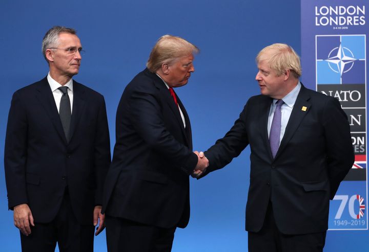 NATO Secretary General Jens Stoltenberg, left, and British Prime Minister Boris Johnson, right, welcome U.S. President Donald Trump during a NATO leaders meeting at The Grove hotel and resort in Watford, Hertfordshire, England, Wednesday, Dec. 4, 2019. 