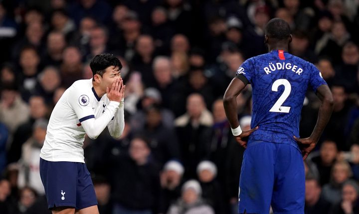 Tottenham Hotspur's Son Heung-min reacts as the VAR reviews a challenge that resulted in a red card for this challenge on Chelsea's Antonio Rudiger