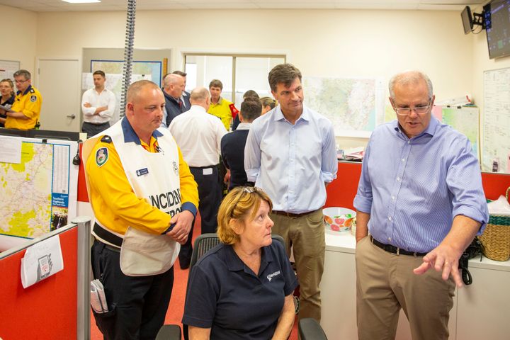 Prime Minister Scott Morrison talks to a volunteer at The Picton Evacuation Centre on December 22, 2019 in Picton, Australia.