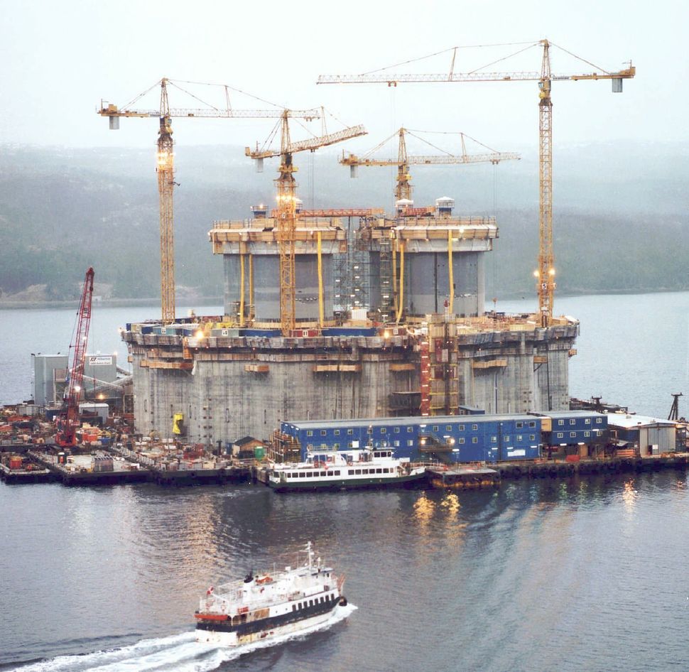 Construction crews are seen here putting the finishing touches on the massive base section of the $4.2-billion Hibernia offshore oil platform in Bull Arm, N.L., in April 1996. The federal government bought a stake in the project in 1993 to help save it from collapse.