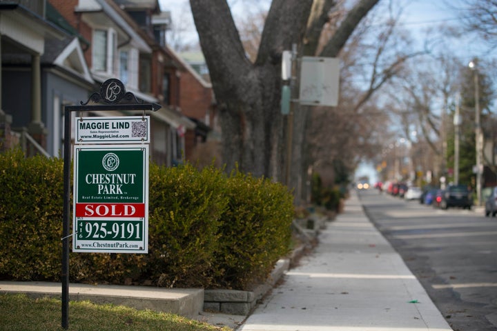 A house for sale in a Toronto neighbourhood, April 2015. The Ontario government is encouraging potential homeowners to consider co-ownership as a way of getting into the housing market.