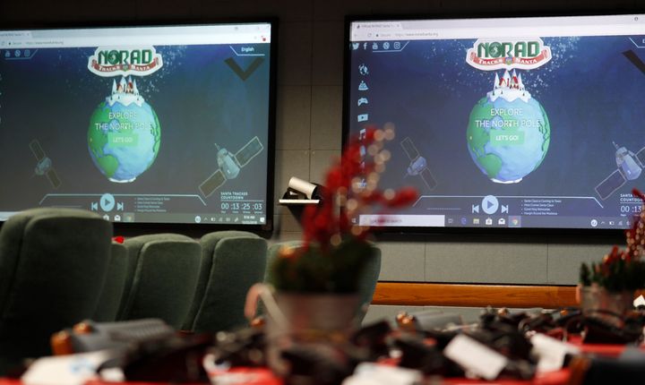 Monitors are illuminated in the NORAD Tracks Santa center at Peterson Air Force Base, Monday, Dec. 23, 2019, in Colorado Springs, Colo. More than 1,500 volunteers will answer an estimated 140,000 telephone calls from childfren and their parents who will be checking on the whereabouts of Santa Clau on Christmas Eve. (AP Photo/David Zalubowski)