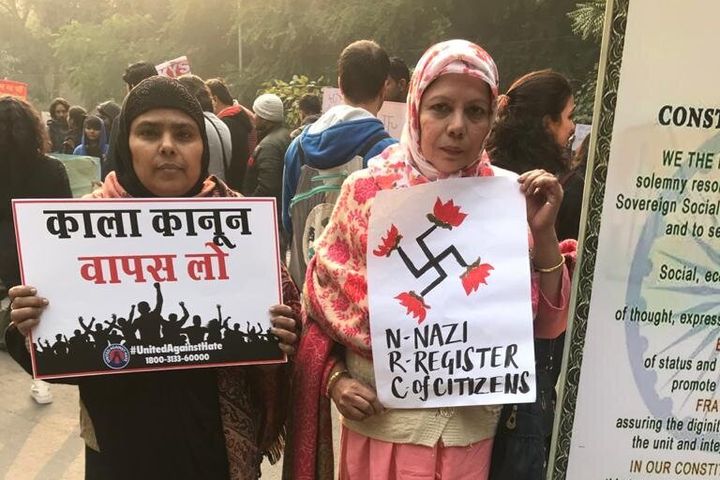 Women protesters hold posters opposing the National Register of Citizens in Jantar Mantar on 24 December, 2019. 