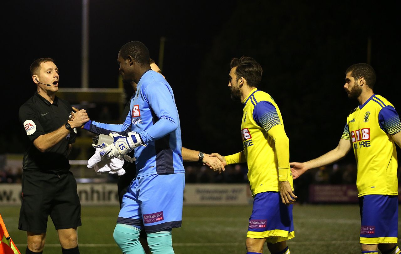 Haringey Borough goalkeeper Valery Pajetat (left) walks out onto the pitch at the start of the FA Cup fourth qualifying round replay match at Coles Park Stadium, London.