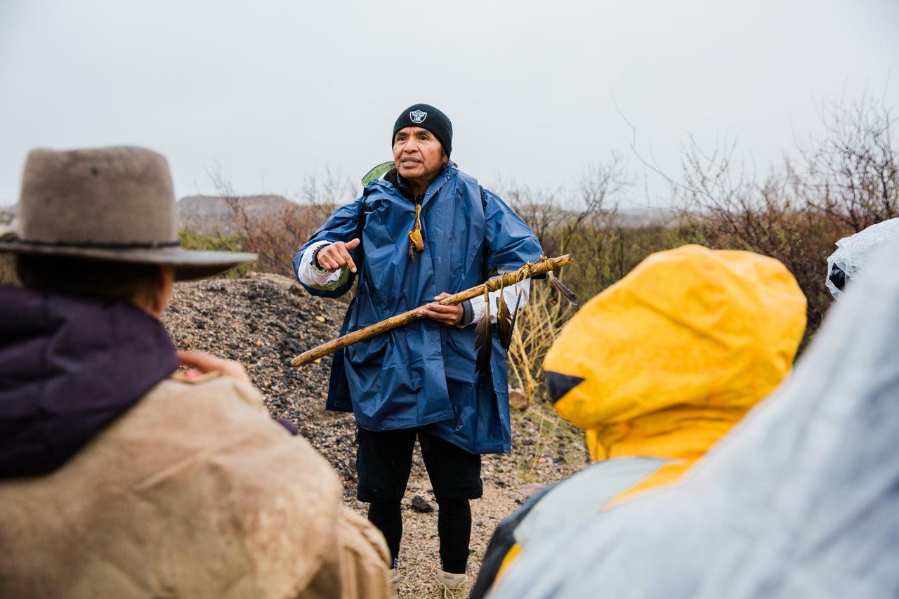 Wendsler Nosie Sr., 60, speaks with supporters at their camp on Nov. 29 before setting off on the second day of his prayer run protest on the San Carlos Apache reservation.