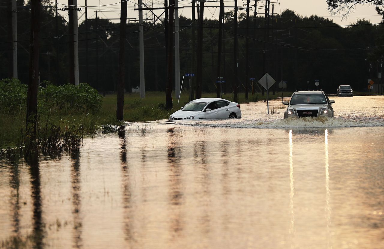 A truck drives through high water in Orange, Texas, a week after the devastation of Hurricane Harvey in September 2017