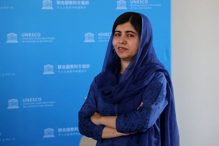 Nobel laureate Malala Yousafzai poses for photographs during the Education and Development G-7 ministers summit in Paris in J