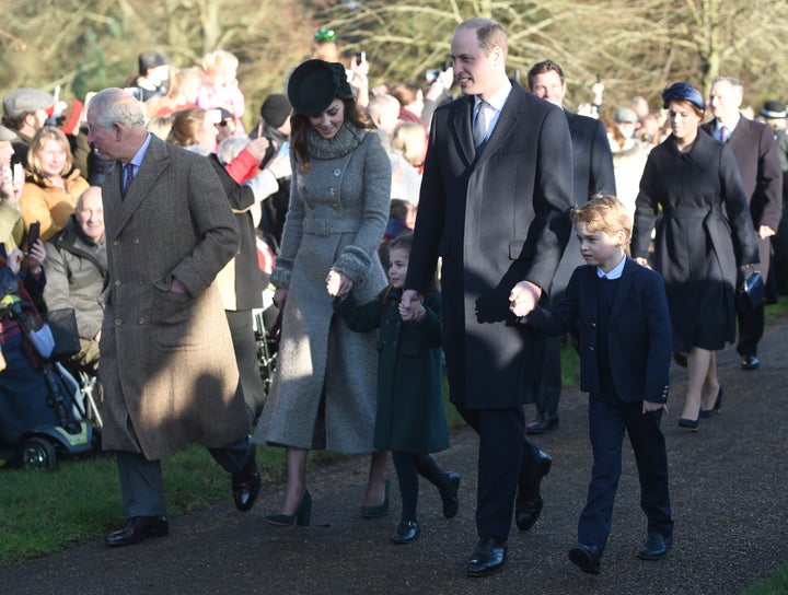 The Prince of Wales with the Duke and Duchess of Cambridge and their children Prince George and Princess Charlotte
