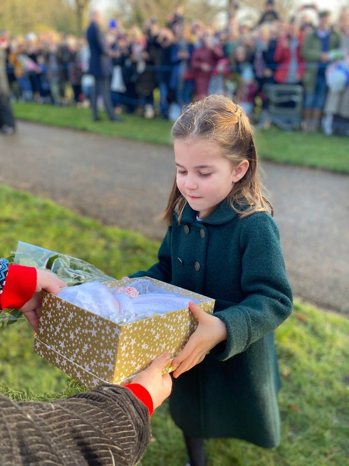 Princess Charlotte accepts a gift 