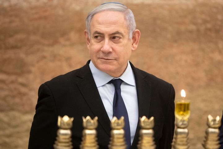 Israeli Prime Minister Benjamin Netanyahu looks on after lighting a Hanukkah candle at the Western Wall on Dec. 22, 2019.