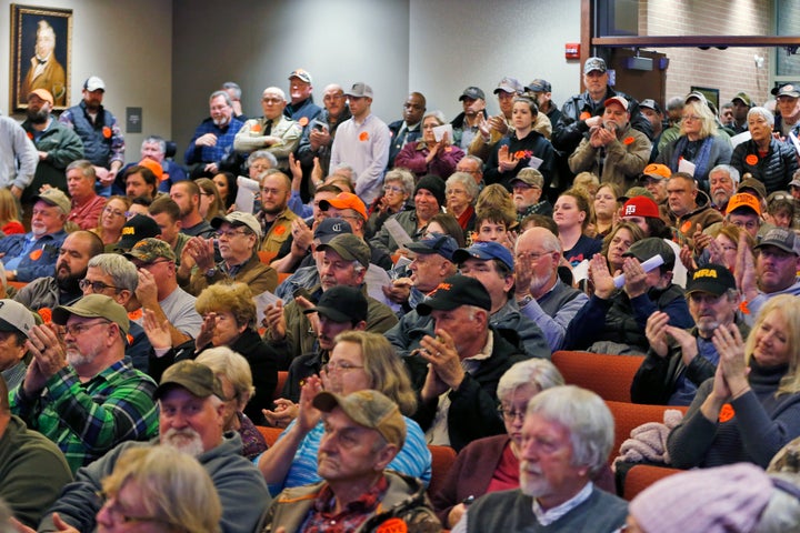 Spectators applaud as the Buckingham County Board of Supervisors unanimously voted to pass a Second Amendment Sanctuary City resolution at a meeting in Buckingham, Virginia, Dec. 9, 2019. The board passed the resolution without any public discussion. 