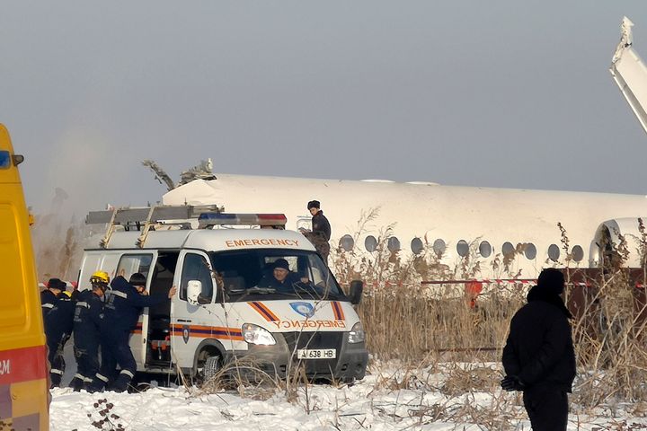 Rescuers work at the site of a plane crashed near Almaty International Airport, outside Almaty, Kazakhstan. 